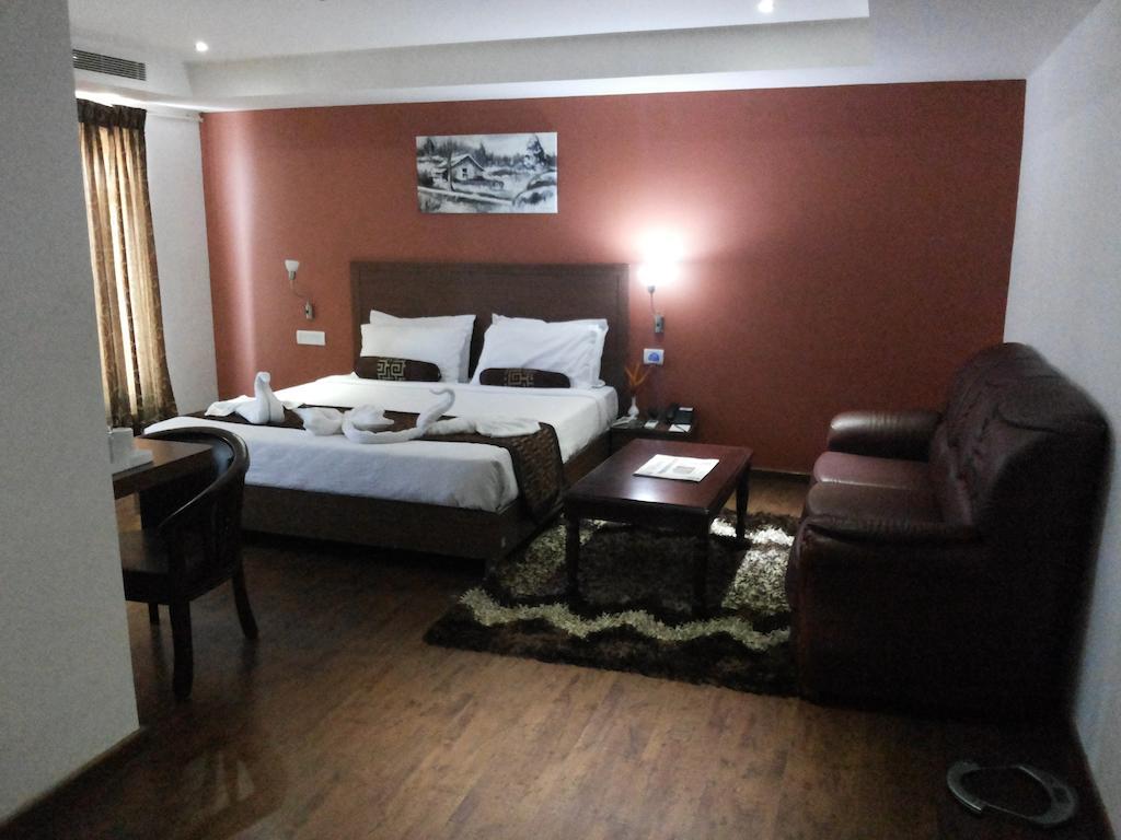Hotel Milestonnez Sriperumbudur Oda fotoğraf